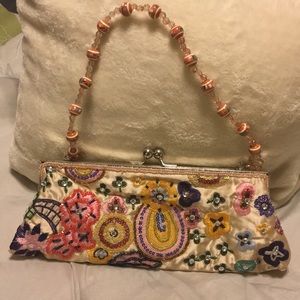 Beige evening bag with an embroidered design